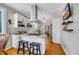 Modern kitchen featuring a gas range, white cabinets, and breakfast bar seating at 99 Berry Tree Dr., Pawleys Island, SC 29585