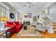 Bright living room with a fireplace, staircase, and plantation shutters at 99 Berry Tree Dr., Pawleys Island, SC 29585