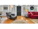 Cozy living area with classic furnishings, hardwood floors, and plantation shutters at 99 Berry Tree Dr., Pawleys Island, SC 29585