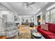 Spacious living area flowing into the dining room, featuring hardwood floors and stylish decor at 99 Berry Tree Dr., Pawleys Island, SC 29585