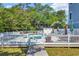 Community pool area with fencing, lounge chairs and an inviting atmosphere at 99 Berry Tree Dr., Pawleys Island, SC 29585