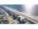 Aerial view of the coastline features residential buildings with beach access and beautiful views of the ocean at 1011 S Ocean Blvd., Surfside Beach, SC 29575