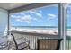 Balcony featuring seating with breathtaking views of the ocean and beach at 1011 S Ocean Blvd., Surfside Beach, SC 29575