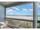 Enjoy breathtaking ocean views from the private balcony with outdoor seating at 1011 S Ocean Blvd., Surfside Beach, SC 29575