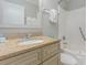Bathroom featuring granite counters, decorative cabinets, and a shower with a bathtub at 1011 S Ocean Blvd., Surfside Beach, SC 29575
