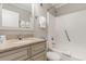 Cozy bathroom features a granite countertop, white cabinets and a shower-tub combo at 1011 S Ocean Blvd., Surfside Beach, SC 29575