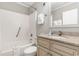 Cozy bathroom features a granite countertop, white cabinets and a shower-tub combo at 1011 S Ocean Blvd., Surfside Beach, SC 29575