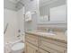 Cozy bathroom featuring granite counters, decorative cabinets, and a shower with a bathtub at 1011 S Ocean Blvd., Surfside Beach, SC 29575