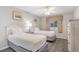 Comfortable bedroom featuring two twin beds, ceiling fan, and beach-themed wall art at 1011 S Ocean Blvd., Surfside Beach, SC 29575