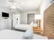 Comfortable bedroom with two beds, dresser and woven headboard at 1011 S Ocean Blvd., Surfside Beach, SC 29575