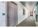 Hallway exterior view with a door leading to unit 203 at 1011 S Ocean Blvd., Surfside Beach, SC 29575