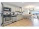 Well-equipped kitchen with stainless steel appliances and view of the living and dining area at 1011 S Ocean Blvd., Surfside Beach, SC 29575