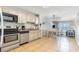 Open kitchen and living space with stainless steel appliances and a dining area at 1011 S Ocean Blvd., Surfside Beach, SC 29575