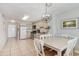 Open kitchen with stainless appliances and a dining table with seating for six at 1011 S Ocean Blvd., Surfside Beach, SC 29575