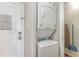 Convenient in-unit laundry closet with stacked washer and dryer, plus a cleaning closet at 1011 S Ocean Blvd., Surfside Beach, SC 29575