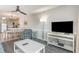 Open-concept living room and dining area with modern decor and natural light at 1011 S Ocean Blvd., Surfside Beach, SC 29575