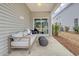 Comfortable back porch with an outdoor couch, decorative pillows, and backyard access at 1013 Hainer Place Dr, Conway, SC 29526