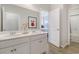 Bright bathroom featuring double vanity, white cabinets, and an attractive mirror at 1013 Hainer Place Dr, Conway, SC 29526