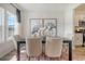 Dining room with table and chairs, next to a kitchen with modern appliances and finishes at 1013 Hainer Place Dr, Conway, SC 29526