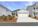 Inviting single-story home with a two-car garage, tidy landscaping, and a welcoming entrance at 1013 Hainer Place Dr, Conway, SC 29526