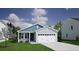 Charming single-story home with a two car garage, black door, and manicured lawn at 1013 Hainer Place Dr, Conway, SC 29526