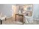 Bright office space with a wood desk, comfortable chair, and stylish artwork, creating an inspiring work environment at 1013 Hainer Place Dr, Conway, SC 29526