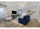 Bright living room featuring modern furnishings, hardwood floors, and sliding doors that provide natural light at 1013 Hainer Place Dr, Conway, SC 29526