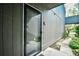Close-up of a unit entrance showing the siding, walkway, and entry with adjacent landscaping at 10301 N Kings Hwy. # 21-5, Myrtle Beach, SC 29572