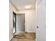The home's bright foyer features durable wood-look flooring, a coat closet, and neutral walls at 10301 N Kings Hwy. # 21-5, Myrtle Beach, SC 29572