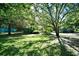 Community green space with mature shade trees and lush grass at 10301 N Kings Hwy. # 21-5, Myrtle Beach, SC 29572