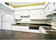 The kitchen shows white appliances and cabinets with a practical layout and adjacent countertop space at 10301 N Kings Hwy. # 21-5, Myrtle Beach, SC 29572
