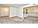 Living area view features neutral walls, carpet, and a view to a pass-through to the kitchen at 10301 N Kings Hwy. # 21-5, Myrtle Beach, SC 29572