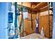 A look inside a wood paneled storage room or utility area, showing the electrical box and utility items at 10301 N Kings Hwy. # 21-5, Myrtle Beach, SC 29572