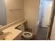 Well-lit bathroom with toilet, sink, towel rack, and access to bathtub at 10301 N Kings Hwy. # 22-11, , SC 29572