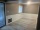 Living room with sliding glass door, hardwood floors, gray-beige colored walls, and large window at 10301 N Kings Hwy. # 22-11, , SC 29572