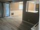 Living room with gray-beige colored walls, hardwood floors, and sliding glass door at 10301 N Kings Hwy. # 22-11, , SC 29572