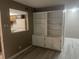 Living room with built-in shelving and view to the kitchen at 10301 N Kings Hwy. # 22-11, , SC 29572