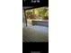 Daytime outdoor view of a wooden patio with wood slats, fence, and trees behind it at 10301 N Kings Hwy. # 22-11, , SC 29572
