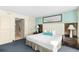 Comfortable bedroom with king bed, stylish headboard and nightstands, and a relaxing ensuite bathroom at 107 S Ocean Blvd. # 1402, Myrtle Beach, SC 29577