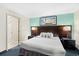 Comfortable bedroom features a queen bed, modern decor, and an ensuite bathroom for a relaxing stay at 107 S Ocean Blvd. # 1402, Myrtle Beach, SC 29577
