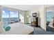 Bright bedroom featuring a balcony with ocean views, a dresser, and relaxing decor at 107 S Ocean Blvd. # 1402, Myrtle Beach, SC 29577