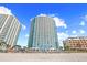 Contemporary high-rise condo building situated on a pristine beach, offering luxurious coastal living at 107 S Ocean Blvd. # 1402, Myrtle Beach, SC 29577