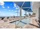 Inviting lounge area with an in-ground pool, covered lounge space and chairs for ultimate relaxation at 107 S Ocean Blvd. # 1402, Myrtle Beach, SC 29577