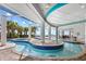 Leisure pool with shaded seating area, palm trees and distant ocean views under a sunny sky at 107 S Ocean Blvd. # 1402, Myrtle Beach, SC 29577