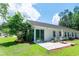 Exterior of the home featuring a Florida room, patio, landscaping, and lawn at 111 Rose Water Loop # 111, Myrtle Beach, SC 29588