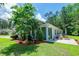 Backyard view of home with a Florida room, patio and a well-maintained lawn at 111 Rose Water Loop # 111, Myrtle Beach, SC 29588