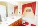 Bathroom featuring double vanity, shower, tub and red accent rugs and curtains at 111 Rose Water Loop # 111, Myrtle Beach, SC 29588