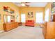 Bright bedroom with yellow walls, carpet flooring, and vibrant red furniture sets at 111 Rose Water Loop # 111, Myrtle Beach, SC 29588