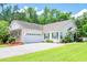 Charming one-story home with an attached garage, well-maintained lawn, and tidy landscaping at 111 Rose Water Loop # 111, Myrtle Beach, SC 29588