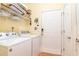 Bright laundry room with a washer, dryer, shelving, and ample storage space at 111 Rose Water Loop # 111, Myrtle Beach, SC 29588